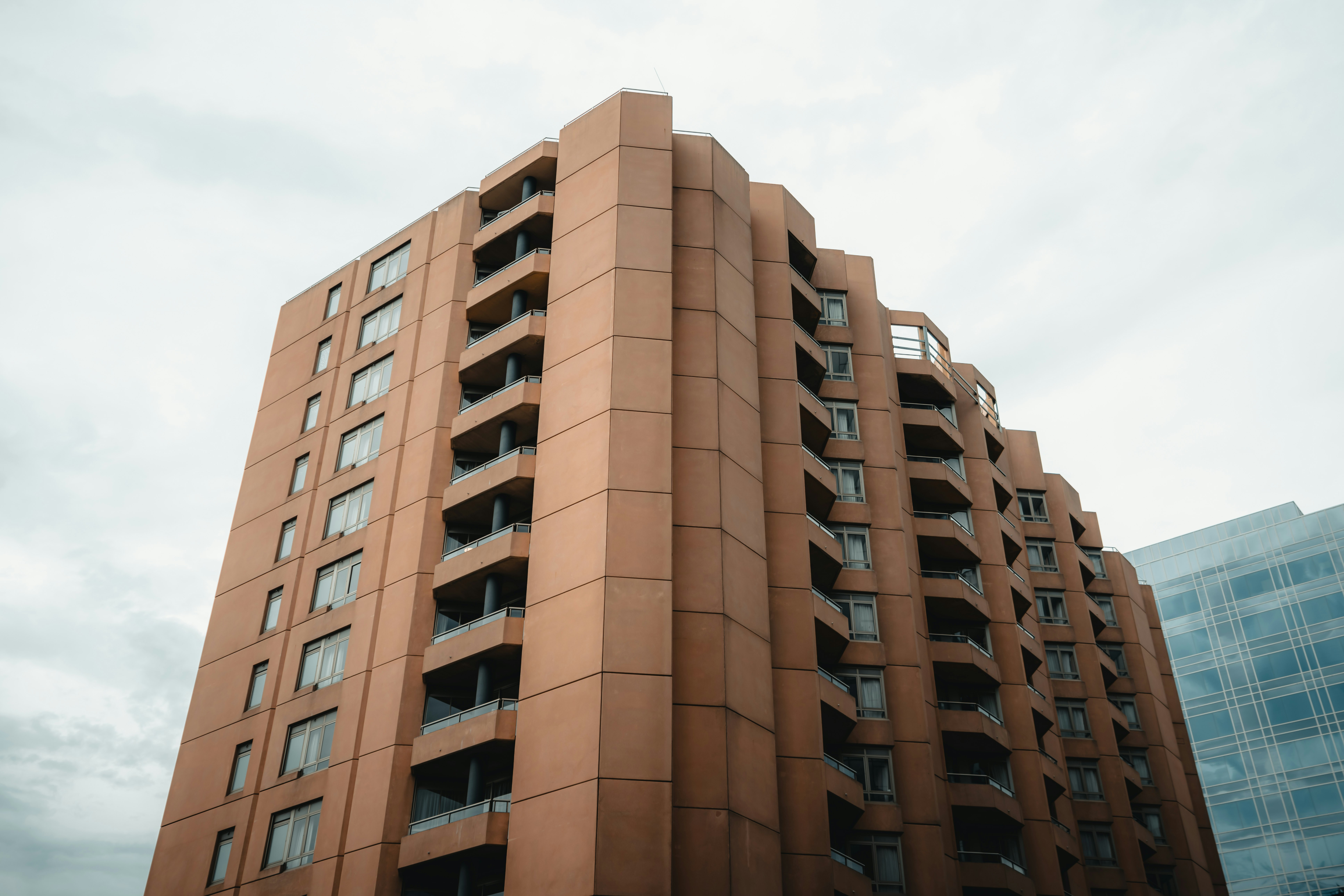 brown concrete building under white sky during daytime